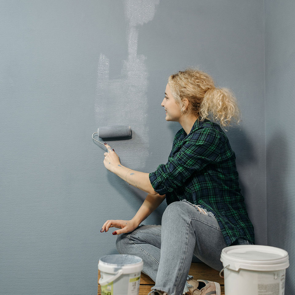 A woman renovating her house